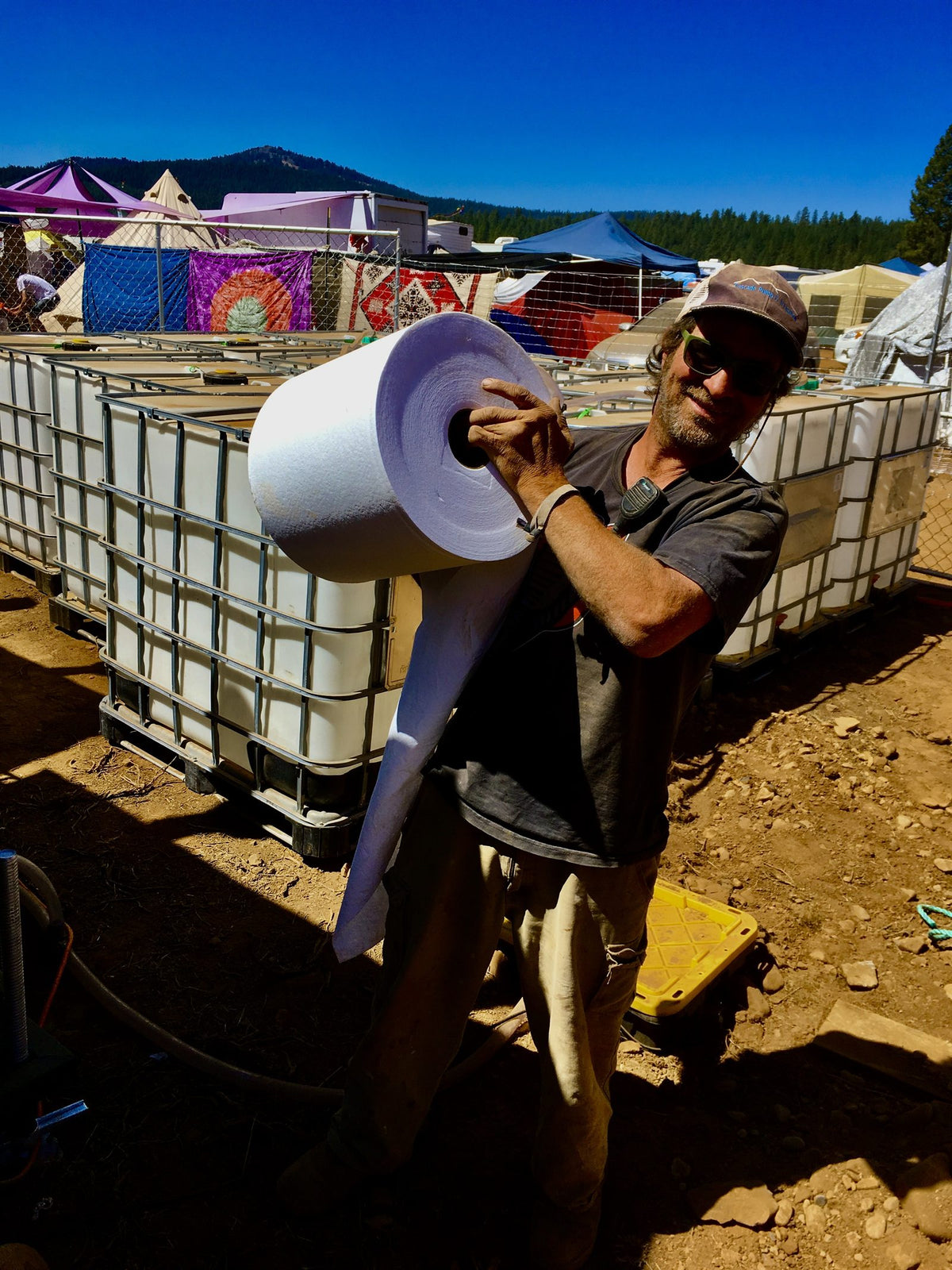 Andy carrying LALA LOO toilet paper at a festival
